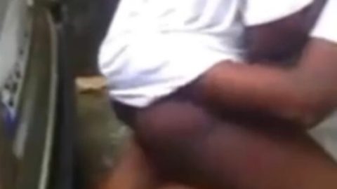 High school students fuck behind car